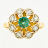 Кольцо из комбинированного золота 750 пробы c 8 бриллиантами и 1 изумрудом