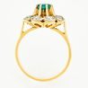 Кольцо из комбинированного золота 750 пробы c 8 бриллиантами и 1 изумрудом