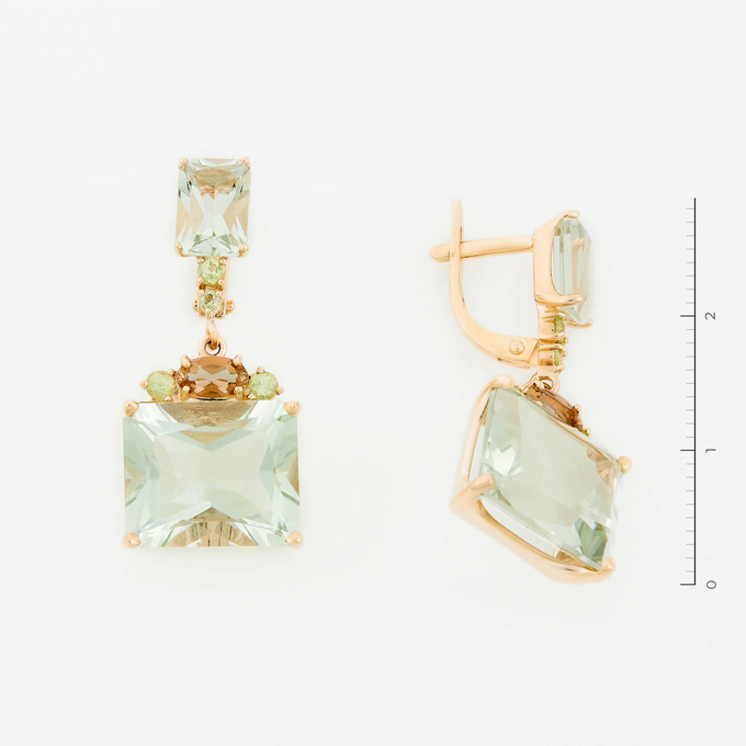 Серьги золото, 585, 2 к.,6,35 гр. (чистый вес 4,35 гр.) со следами износа; 4 Празиолит, 10 Хризолит